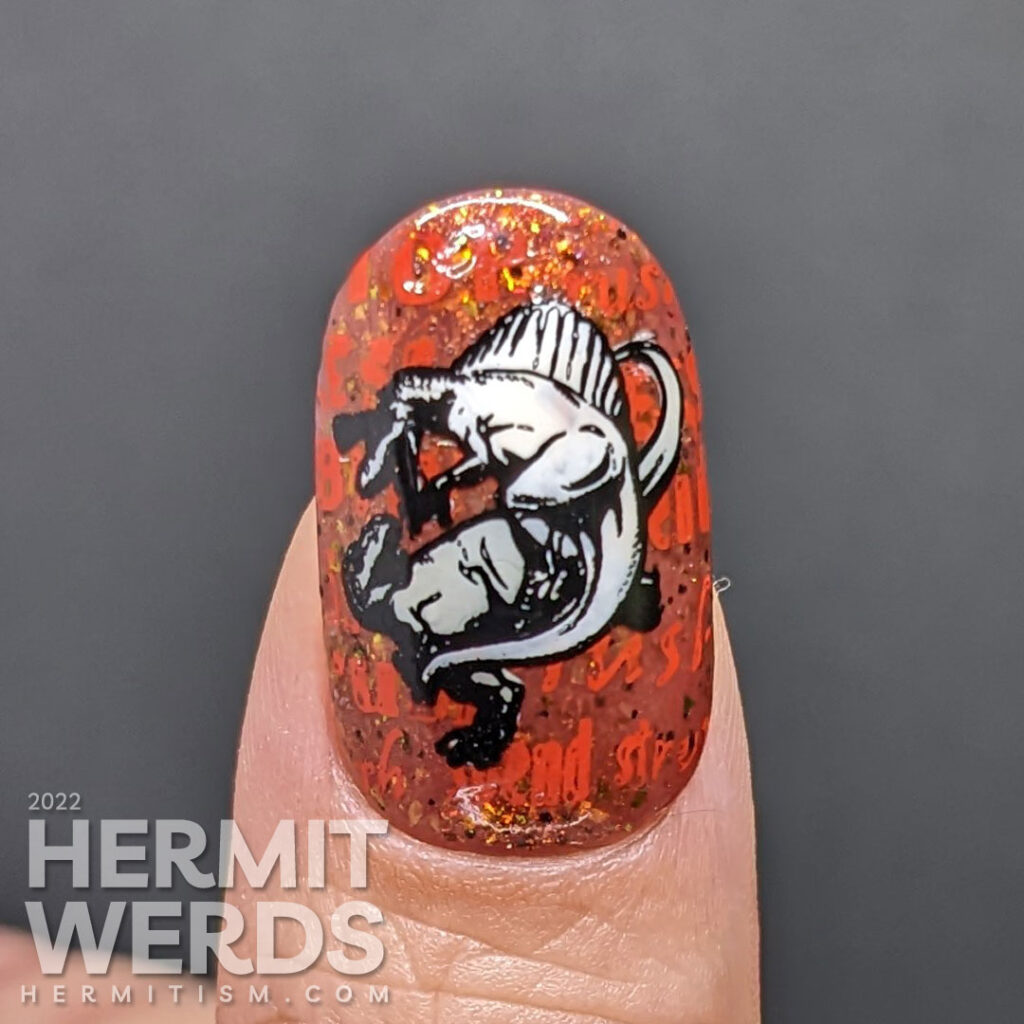 Dinosaur metaphor nail art about the stresses and pressures of Christmas shopping as the dinos battle it out on red backgrounds.