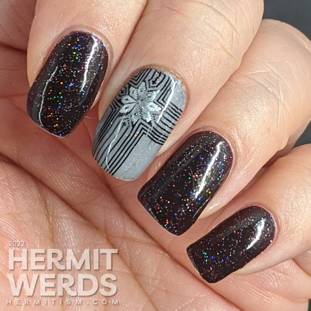 A grey, black, and silver glitzy gift mani for Christmas with double stamped giant bows and ribbons and holographic glitter sparkling away.