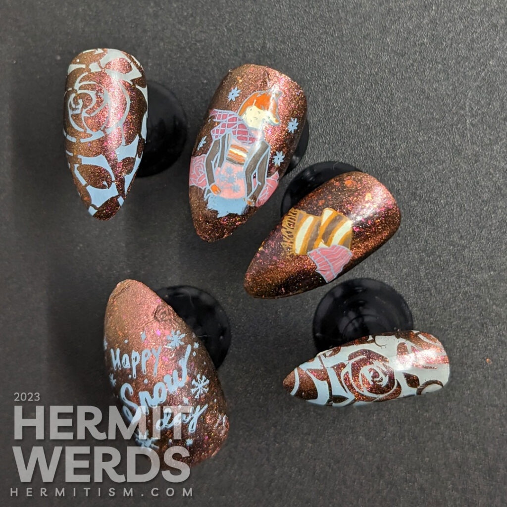 A cozy, matte scarf-wrapped fox nail art with more stamping decals of winter gear, roses, and snowflakes on a copper magnetic base.