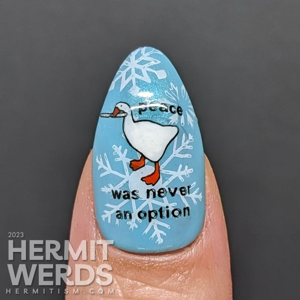 Cool blue goose nail art featuring the Untitled Goose Game's naughty goose and honking on a backdrop of snowflakes. Threat level high.