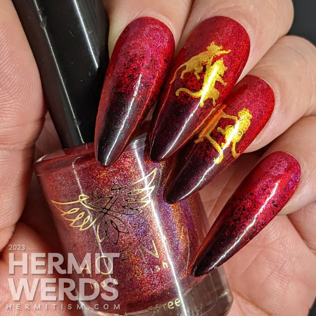 A Lunar New Year nail art for the Year of the Cat, which is the zodiac animal for the Vietnamese in red, black, and gold w/dancing cats.