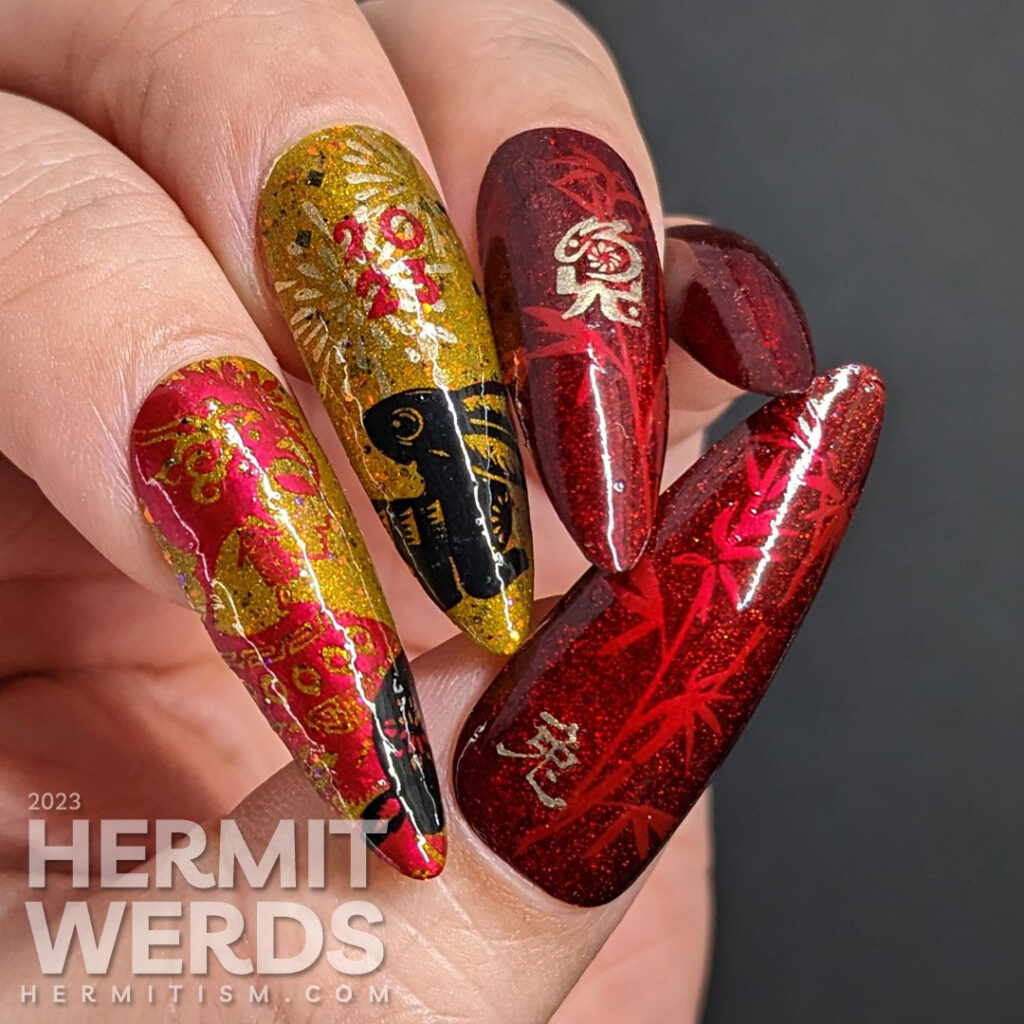 Chinese New Year nail art for the Year of the Rabbit with holographic red, deep mustard, gold, and black polish + rabbit cutouts and bamboo.