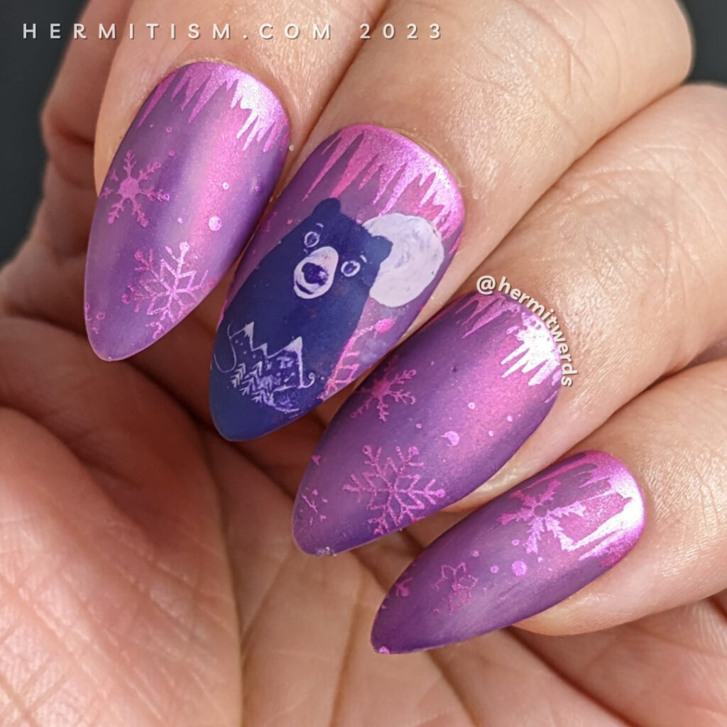 Bear Moon nail art to celebrate the full moon in February on a gorgeous magenta nail polish and snowflakes and icicles in the background.