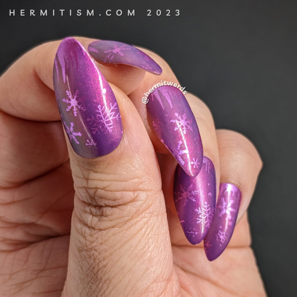 The background for the Bear Moon nail art with just the magenta nail polish base and snowflakes and icicle stamping.