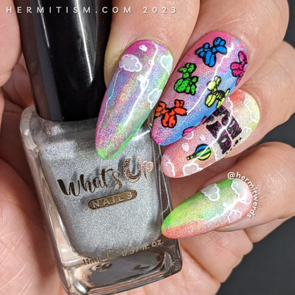 Neon fair/carnival nail art w/stamping decals of balloon animals, hot air balloons, and a rollercoaster on a holographic rainbow background.