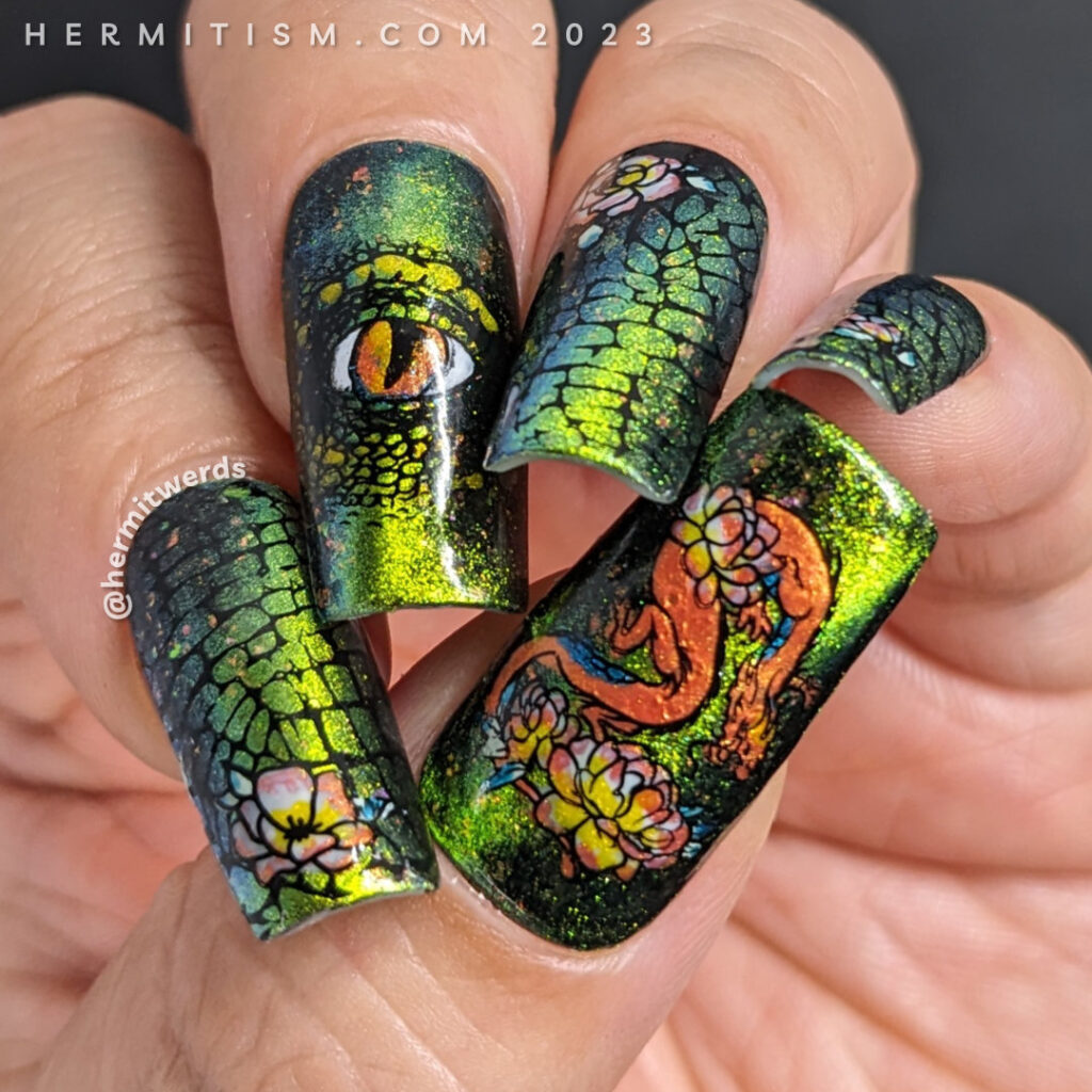 Dragon nail art with a complex magnetic green/aqua base and nail stamping of scales, a dragon eye, and an eastern dragon with flower accents.