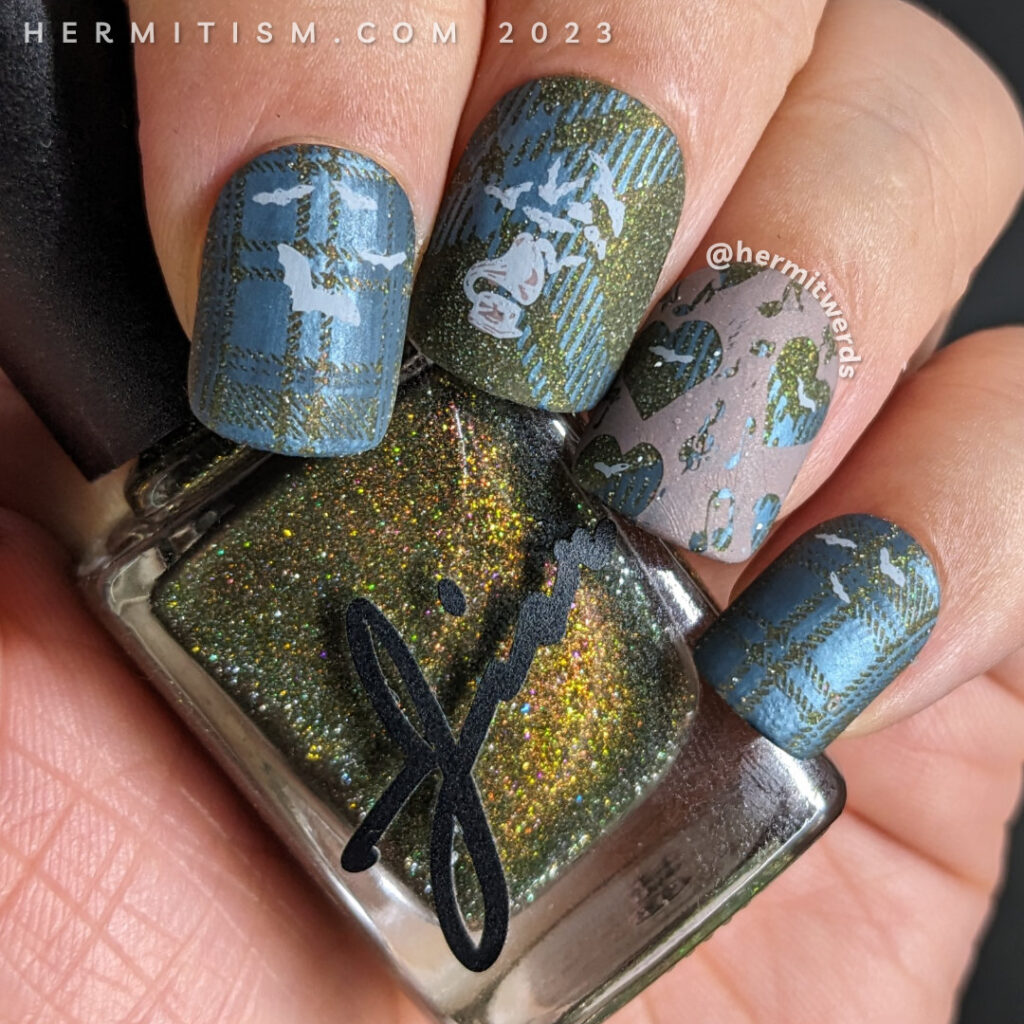 A batty nail art with a background of blue plaid stamped over olive reflective glitter and music and bat stamping decals.