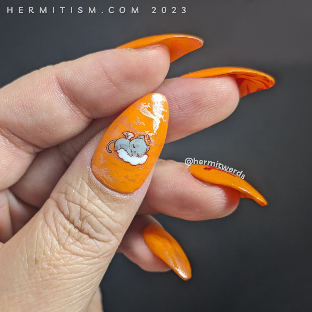 A spicy kitten nail art with devilish kitten stamping decals against a fire-y orange glow in the dark background and one sleepy angel cat.