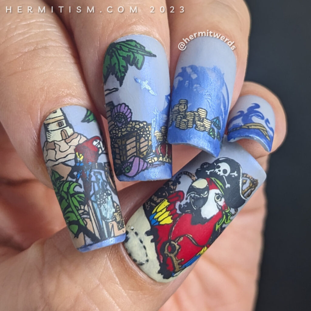 Pirate nail art with tons of pirate details (parrots, treasure chest, gold island, maps, pirate hat, pirate ship, lighthouse, kraken, etc).