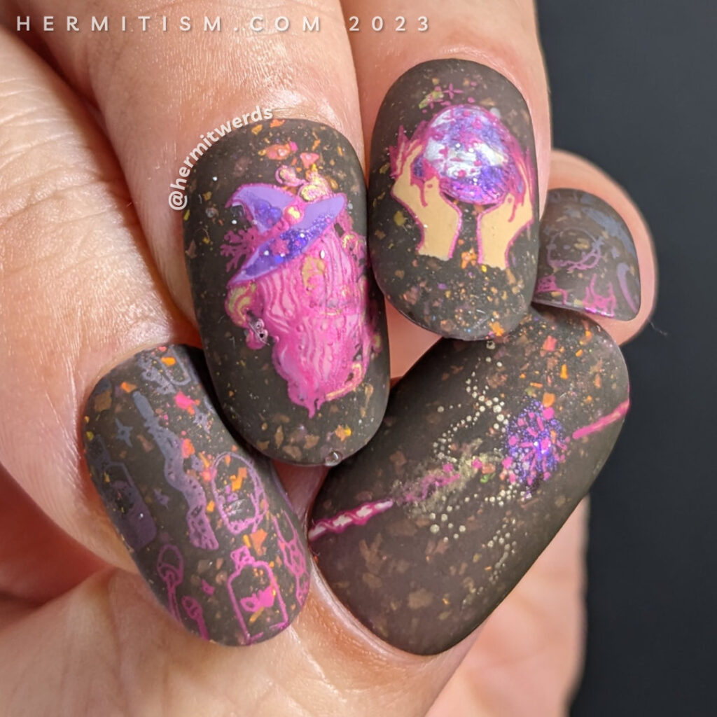 A practicing witch/wizard nail art with decals of potions, wands, crystal balls, etc. on a thermal brown to lilac flakie filled polish.