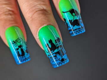 Black cat nail art with cute black cats cavorting across a cityscape with tiny mice stamped on a neon green to sparkly blue gradient.