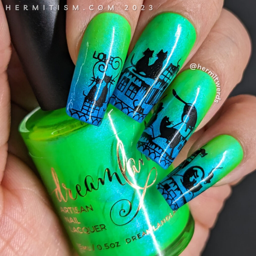 Black cat nail art with cute black cats cavorting across a cityscape with tiny mice stamped on a neon green to sparkly blue gradient.
