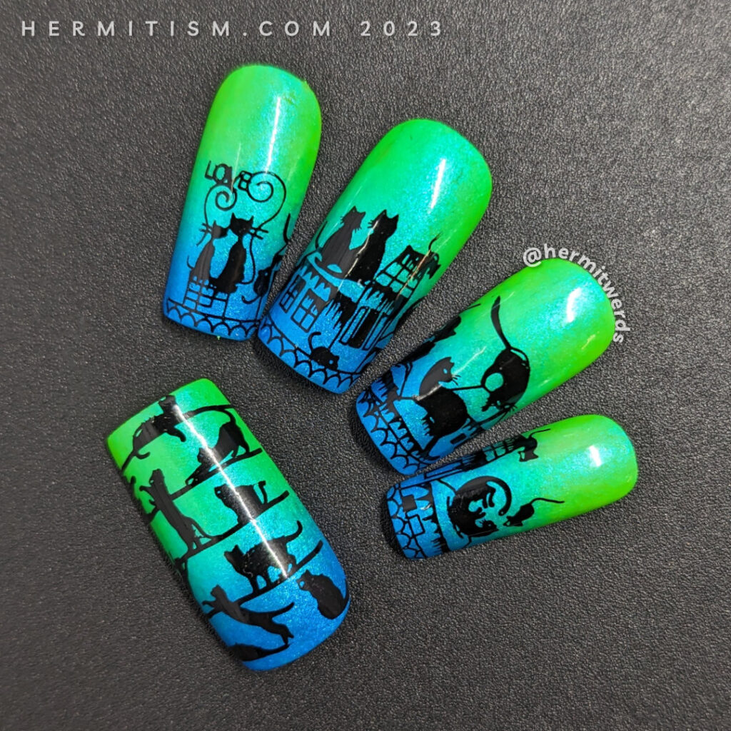 Black cat nail art with cute black cats cavorting across a cityscape with tiny mice stamped on a neon green to sparkly blue gradient.
