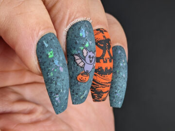 A jack-o-lantern and bats nail art with tiny bats delivering jack-o-lanterns on a dusty teal flakie-filled background for Halloween.
