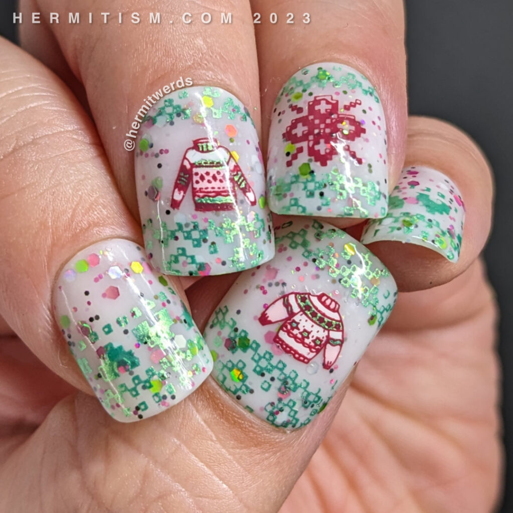 Sweater nail art with cute sweater patterns in red and green on a sweet glittery white crelly and a few sweater decals too. Almost Christmas.