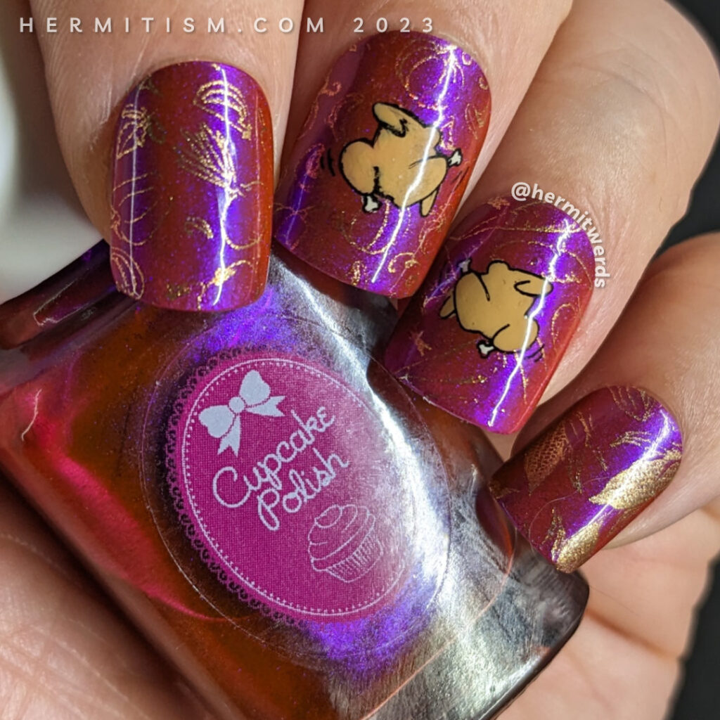 A Thanksgiving nail art with dancing (or fighting) turkeys against a deep orange base with magenta shimmer and copper vegetable stamping.