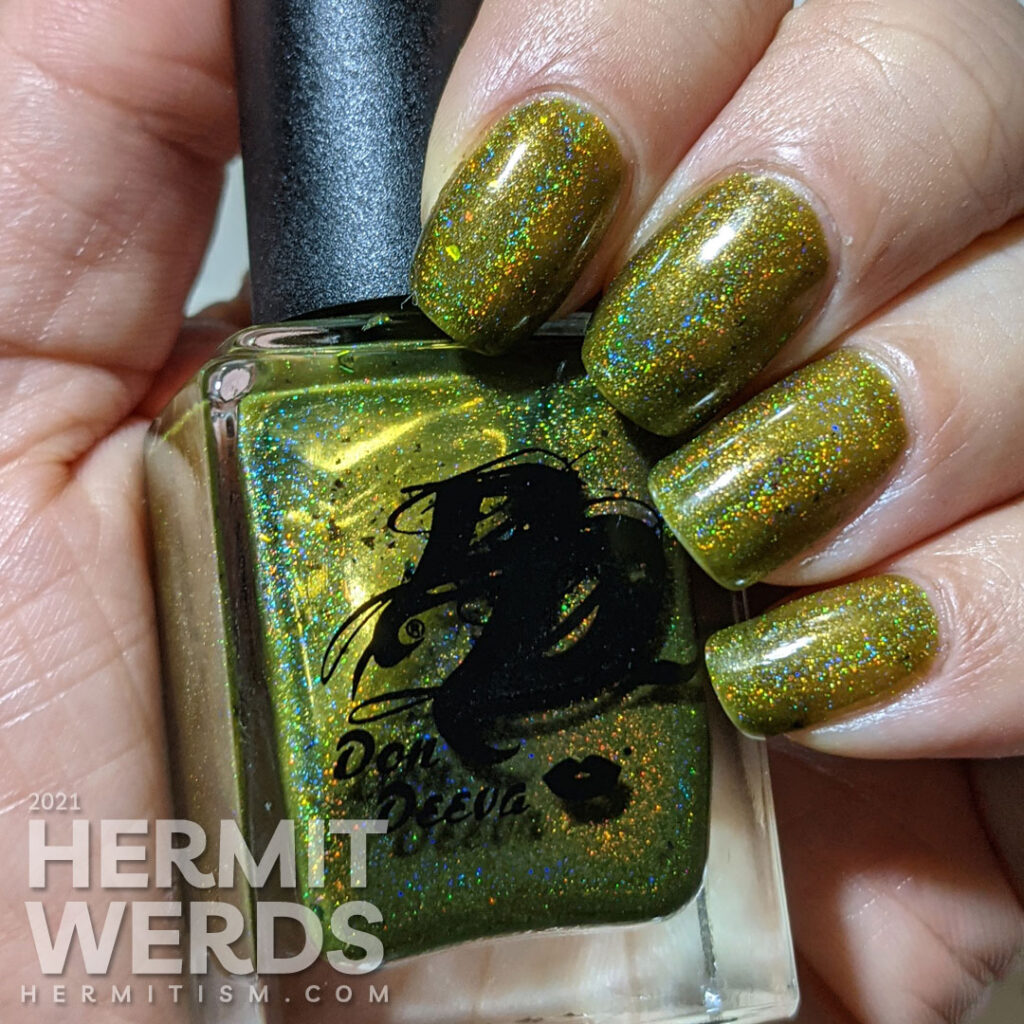 A swatch of The Don Deeva's "Diarrhea of the Mouth", a dark olive green holographic polish.