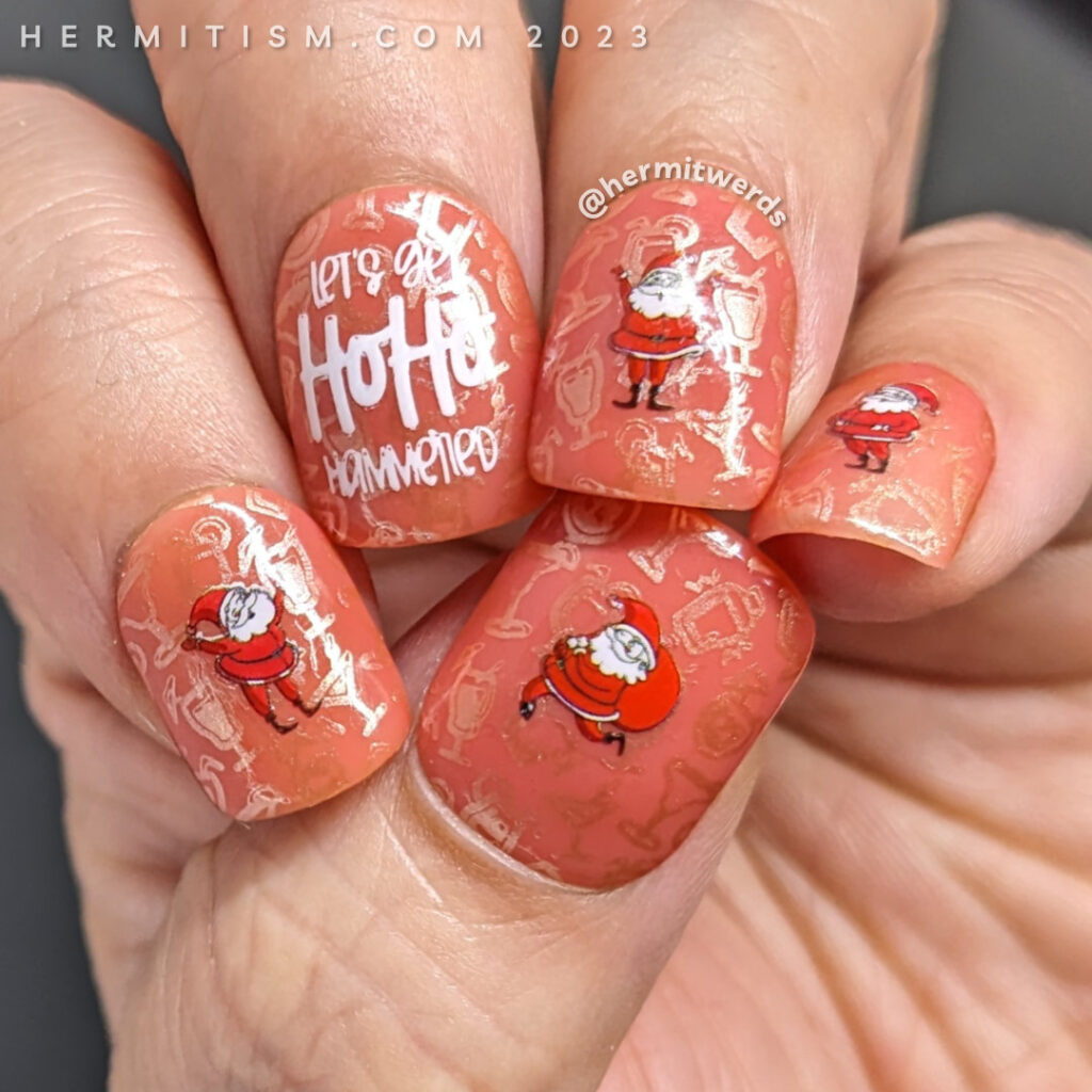 A pink boozy ho ho hammered nail art with wacky-acting Santas who may have had a little too much eggnog while getting ready for Christmas.