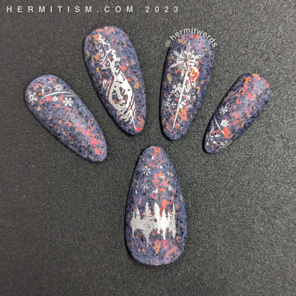 A wintery silver and purple snowflake nail art with silver stamping images of snowflakes and a wolf on a dusty purple flakie crelly.