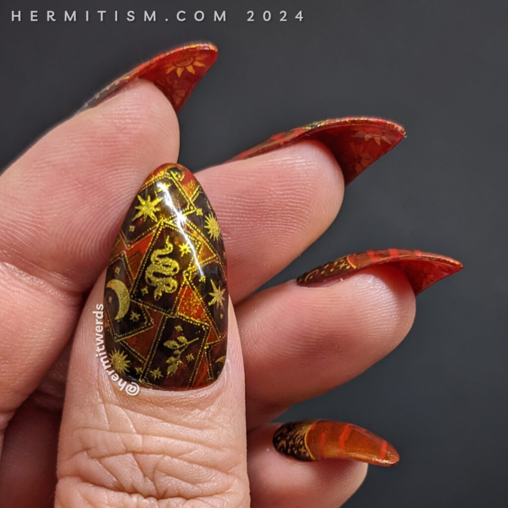 A tarot card mani featuring The Sun card using a space-esque stripped background, sun and moon cycle half moons and golden tarot cards.