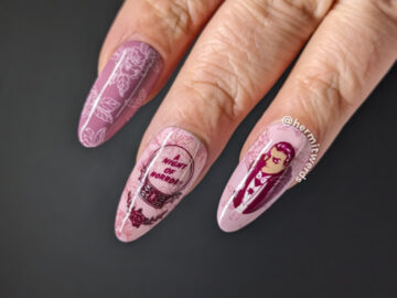 Vampire nail art with a crystal ball inviting you to "A night of horror!" with Dracula and a lady vampire on a floral rose background.