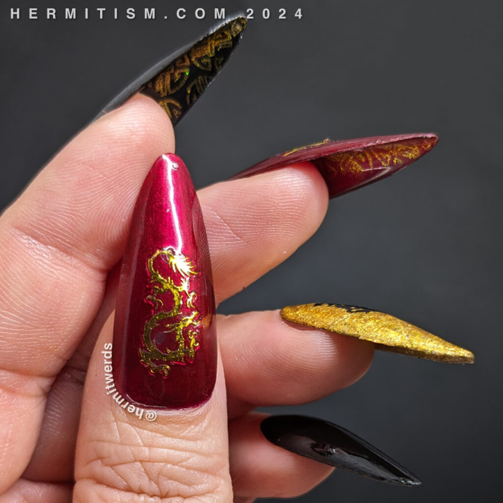 Chinese New Year nail art for the Year of the Dragon w/holographic gold foil, black/red polish, gold nail stickers + a stamped dragon symbol.