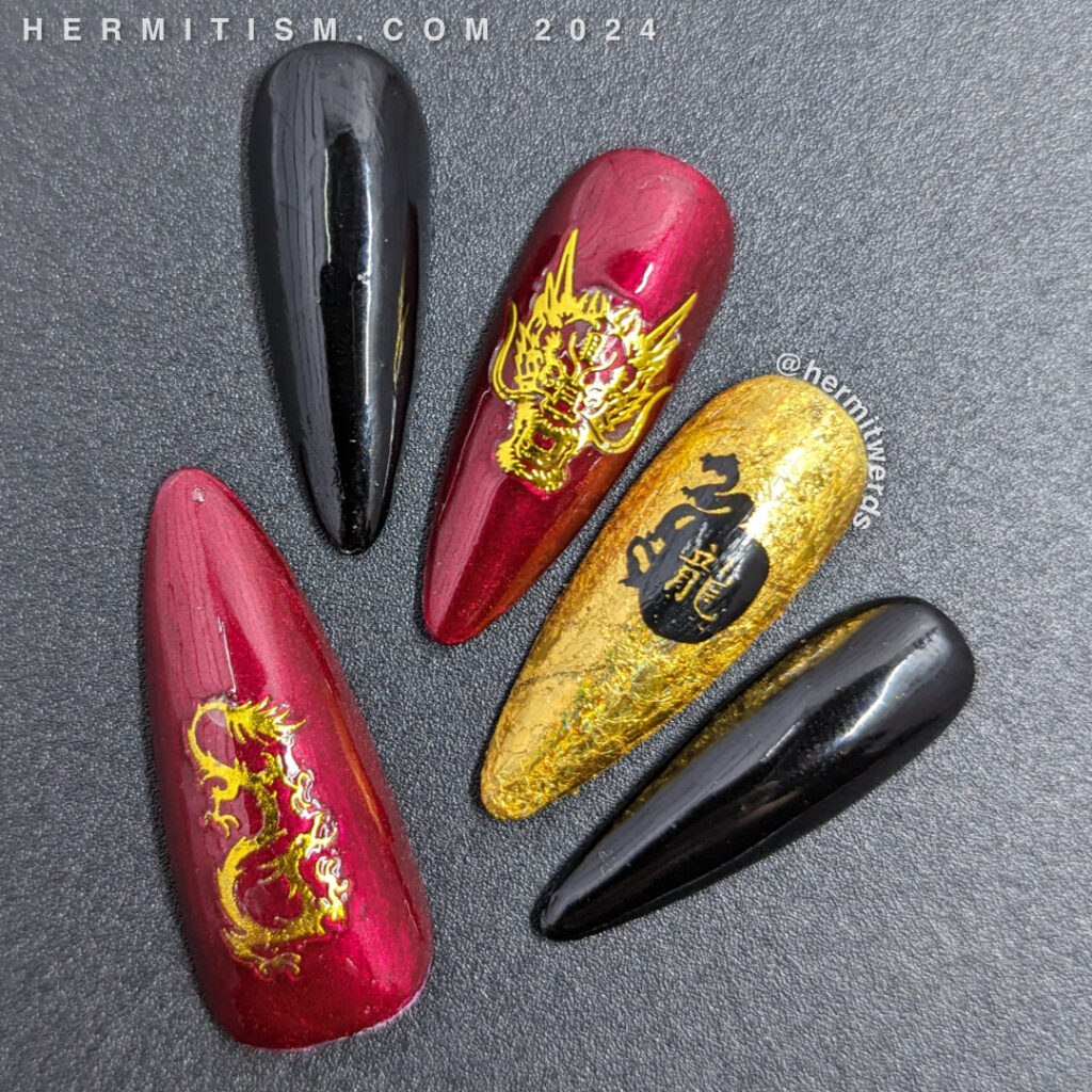 Chinese New Year nail art for the Year of the Dragon w/holographic gold foil, black/red polish, gold nail stickers + a stamped dragon symbol.
