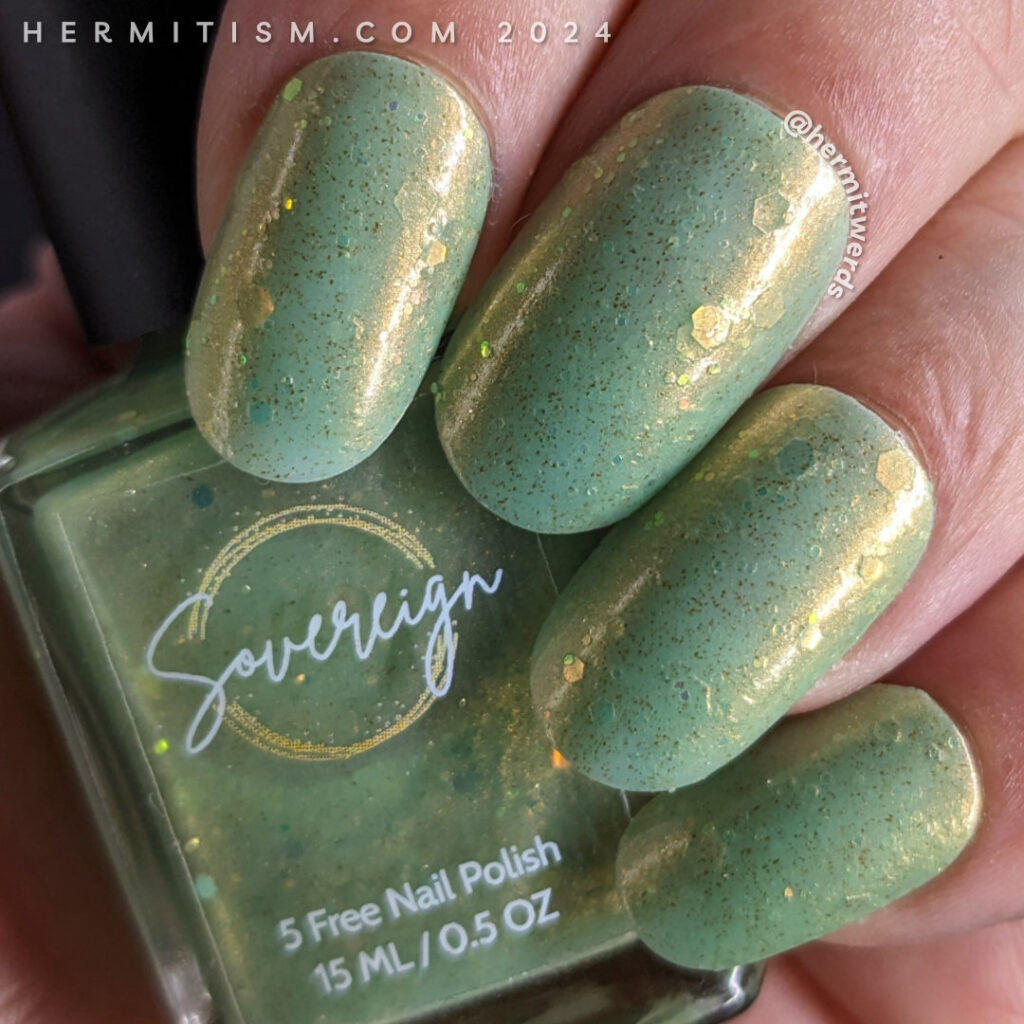 Swatch of Sovereign Beauty's "The Happening", sage green jelly polish with copper shimmer, bronze micro flakes and lots of shifting iridescent glitter for a Mad Hatter nail art.