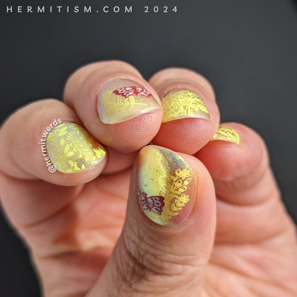 Pastel neon spring nail art with a yellow to green shimmer polish and stamped neon yellow spring flowers with a few colorful butterflies.