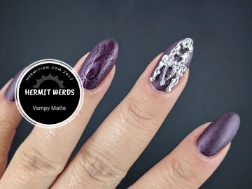 Vampy Matte - Hermit Werds - burgundy holographic matte mani with silver nail shield and glossy stamping