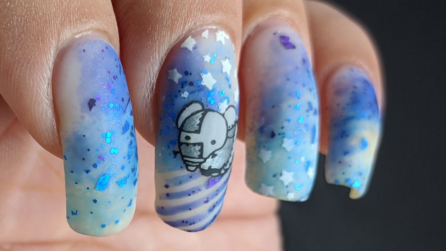 The Robots Remain - Hermit Werds - nail art of little robots against a galactic sky of stars