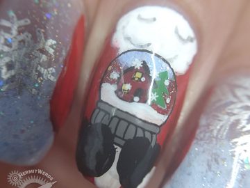 Santa's Coming to Town - Hermit Werds - Santa cradling a snow globe with a snowy home scene in mitten-ed hands