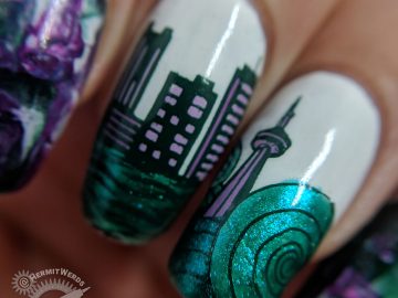 Seattle Tribute - Hermit Werds - nail art for Seattle with a cityscape and the Space Needle bracketed with a smoosh marble in emerald green and purples.