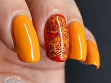 Orange nail art with a fierce tiger stamping decal inspired by Pantone's Orange Tiger color.