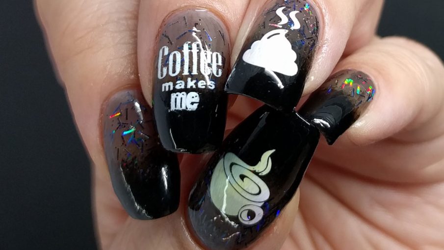 Funny coffee nail stamping decals over black baby boomer french tips with rainbowy bar glitter.