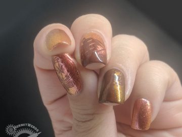 Orange duochrome polish with pirate ship and map stamping decals for Talk Like a Pirate day.