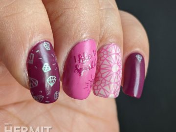 Diamond themed nail art in pinks and purples with an iridescent white crelly accent nail that is covered in faceted gem stamping. "I like to sparkle."