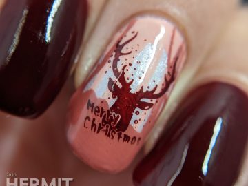 Monochrome red reindeer nail art with deep red polishes and a wintery scene created from layered stamping. Merry Christmas!