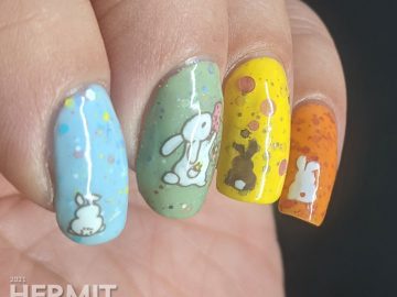 A pastel Easter crelly skittle nail design with a magical bunny, cute bunny butts, and a bunny in a jar for next year.