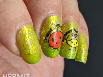 A yellow to bright green thermal polish with sweetly flattering orange and lemon stamping decals on top and more happy food on the thumb.