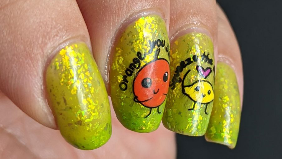 A yellow to bright green thermal polish with sweetly flattering orange and lemon stamping decals on top and more happy food on the thumb.