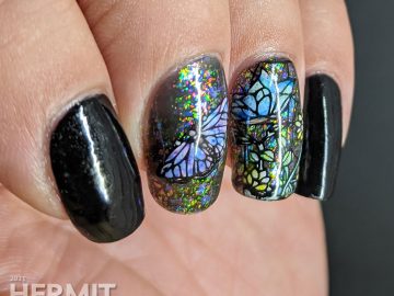 A stained glass butterfly nail art with an iridescent flakie topper and watercolor paint to fill in the butterfly decals.