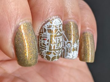 New Years nail art with simple art deco nail stamping on a smoky holographic golden brown base.