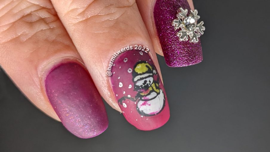 Beautiful berry mani with a textured accent nail + silver snowflake nail charm offset by stamping decals of scary bloody snowmen.