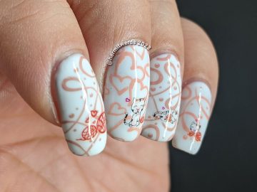 Valentine's nail art in white, red, and pink with water decals of cute white kittens and their love for balls of yarn.