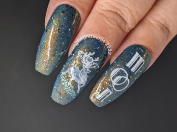 A deep blue and shimmery galaxy nail art celebrating the full buck moon with stamping decals of astral bucks leaping amongst the stars.A deep blue and shimmery galaxy nail art celebrating the full buck moon with stamping decals of astral bucks leaping amongst the stars.