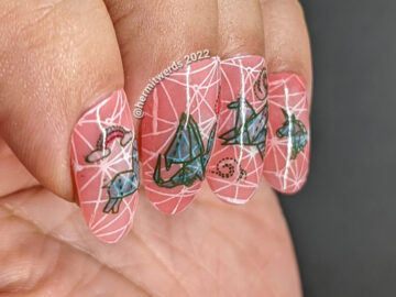 Mythical nail art with teal origami stamping decals of dragons, unicorns, and Pegasus on top of a jelly coral base and pond geometric pattern.
