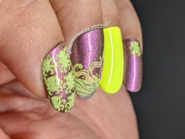 A magnetic monstrous purple-y pink and neon yellow-green kraken nail art with stamping decals of kraken patterns and tentacles in the ocean.