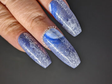 A periwinkle frost moon nail art for the full moon in November with a frosty ice castle stamped underneath.