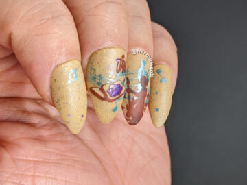 A toasty nail design that combines stamping decals of jamming out to rock music and jam on toast for January.